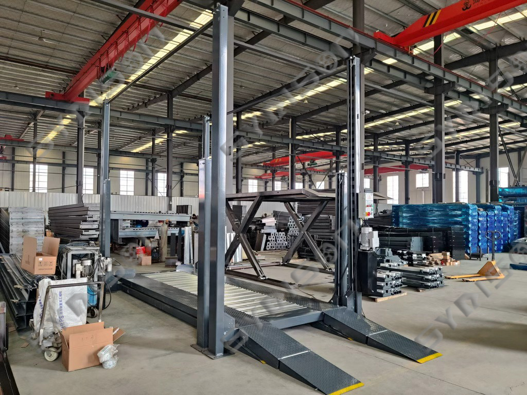 Two platforms of TFPP triple stacker on the ground ready for car loading