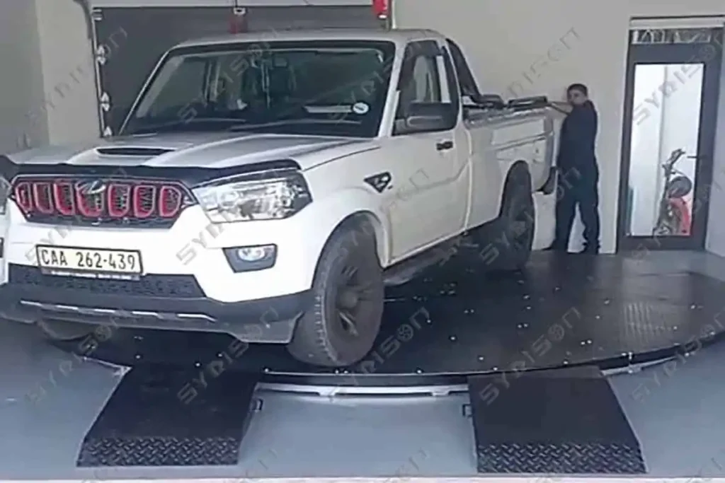 Surface-mounted rotating vehicle platform for commercial parking facilities