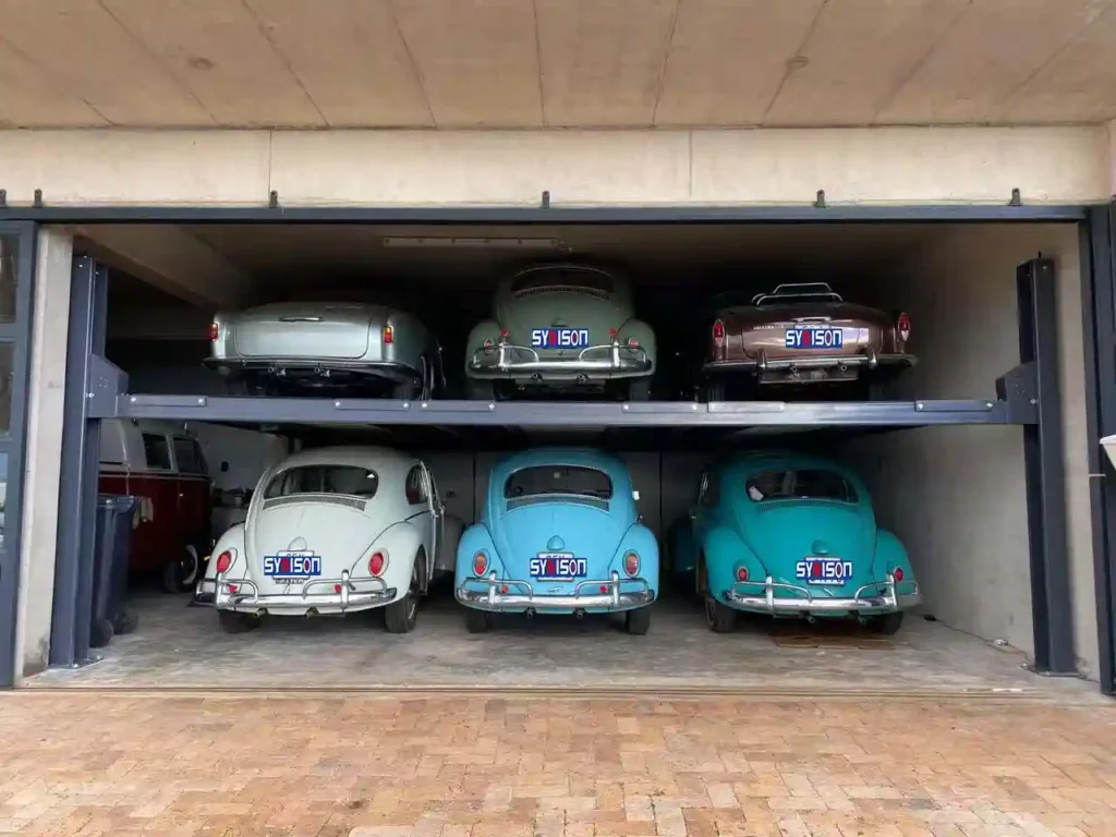 Triple wide 4 post car stacker parking lift storing 6 classic cars in residential garage
